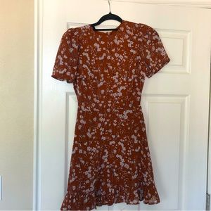 Bohme brown floral mini sun dress, size XS. Ruffle details on hem, nipped waist